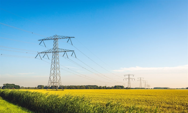 Power lines in a farm field